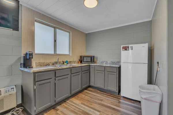 a bedroom with two beds and painting on the wall