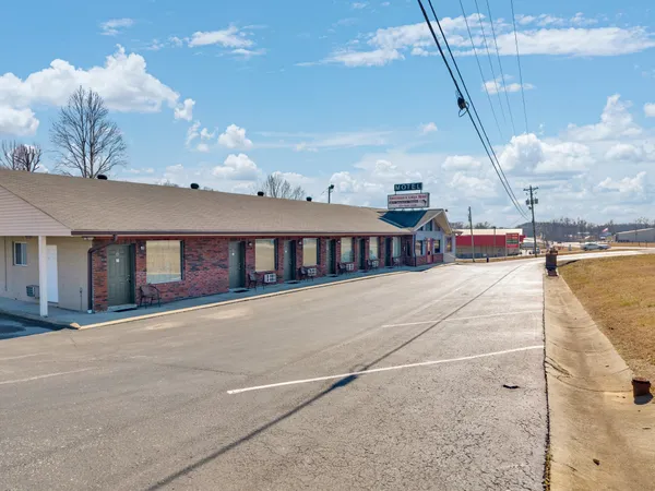 a view of a house with a backyard