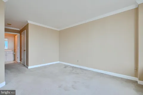 a bedroom with a bed and large window