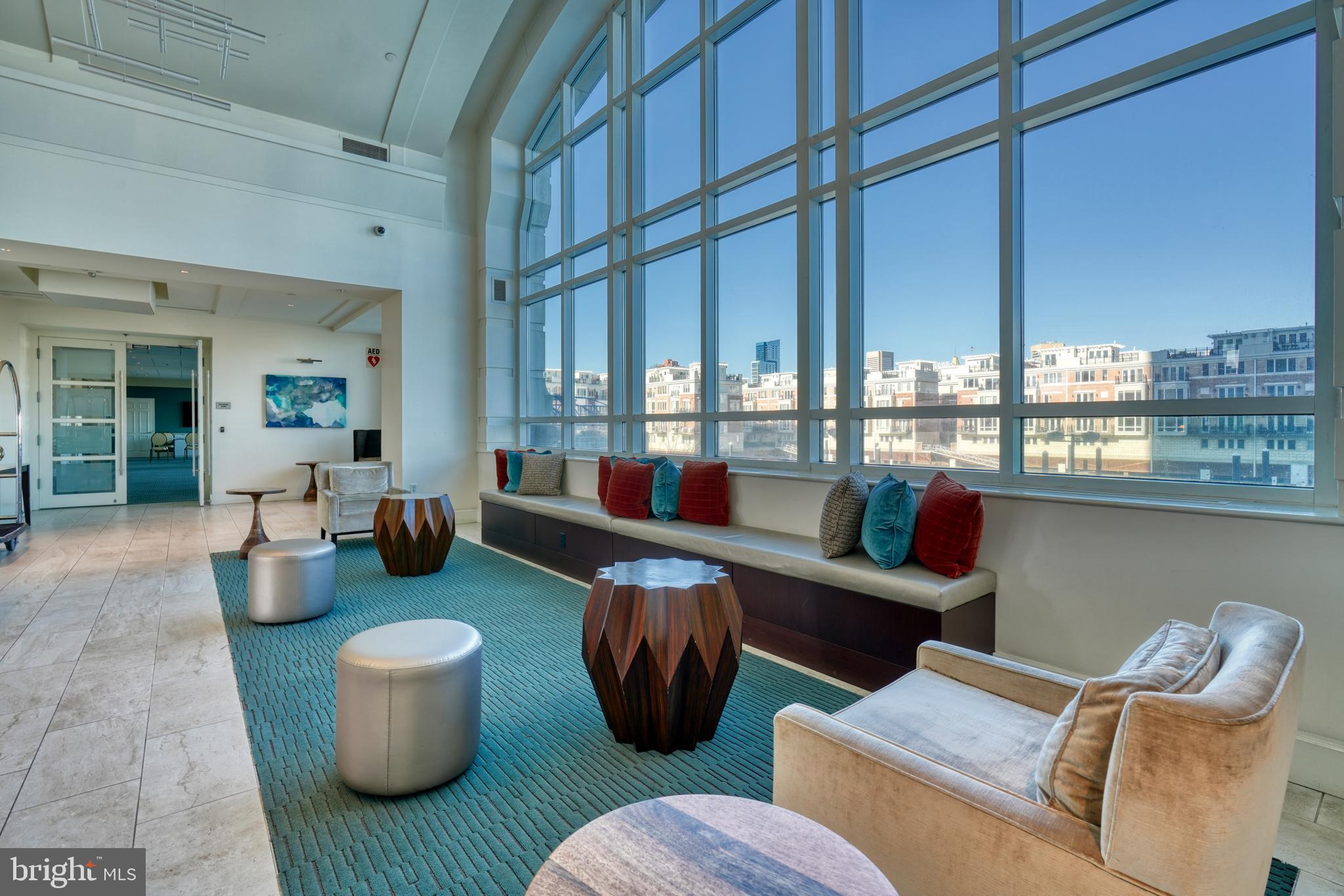 100 Harborview Drive, Unit 609 Baltimore, MD 21230 - Photo 38 of 45 a living room with furniture and a potted plant