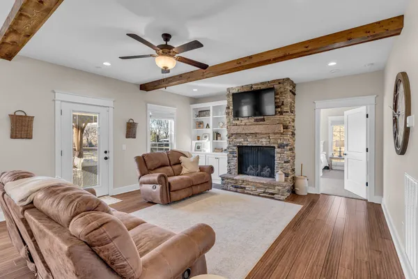 a living room with furniture and a fireplace