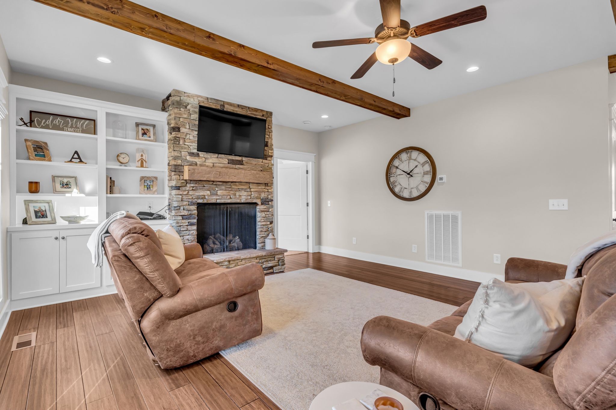5574 Dowlen Road Cedar Hill, TN 37032 - Photo 16 of 59 a living room with furniture and a fireplace