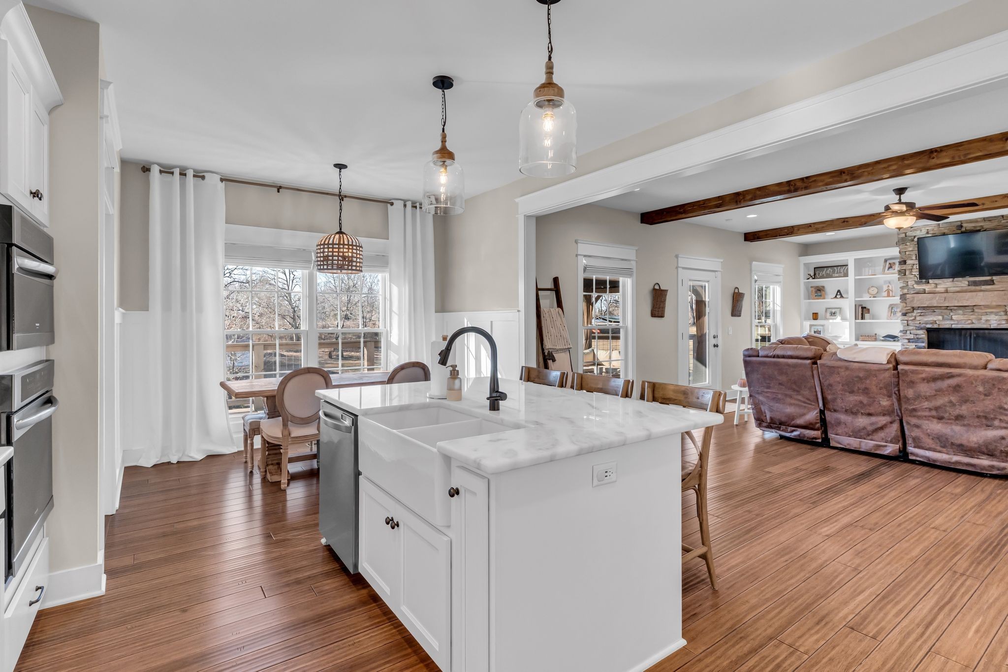 5574 Dowlen Road Cedar Hill, TN 37032 - Photo 18 of 59 a large kitchen with stainless steel appliances granite countertop a lot of counter space and wooden floors