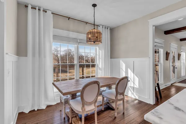 a kitchen with stainless steel appliances granite countertop a sink and a stove with cabinets