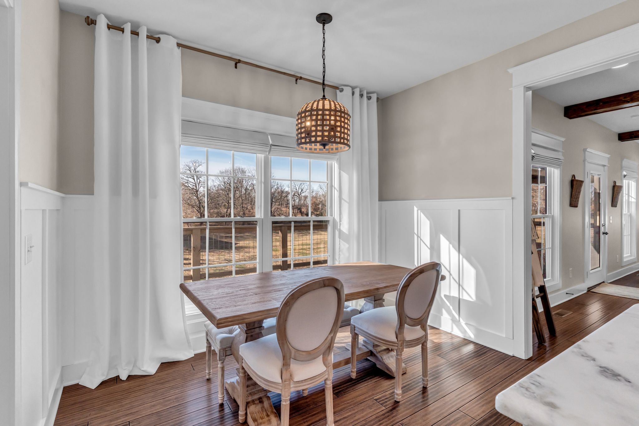 5574 Dowlen Road Cedar Hill, TN 37032 - Photo 19 of 59 a dining room with furniture a chandelier and wooden floor