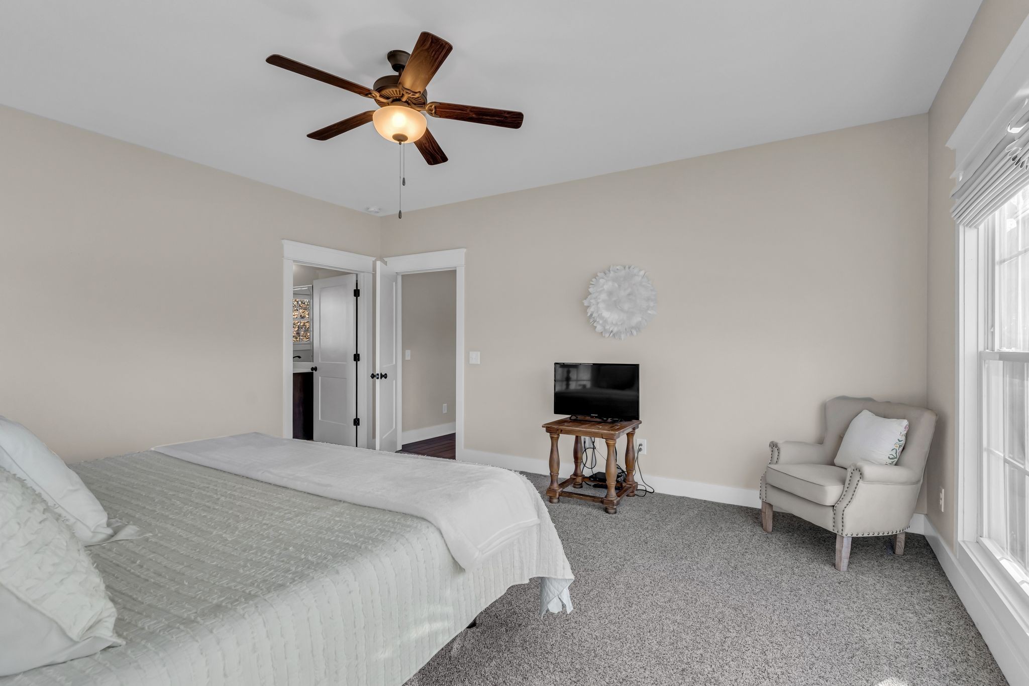 5574 Dowlen Road Cedar Hill, TN 37032 - Photo 25 of 59 a bedroom with a bed and a chair