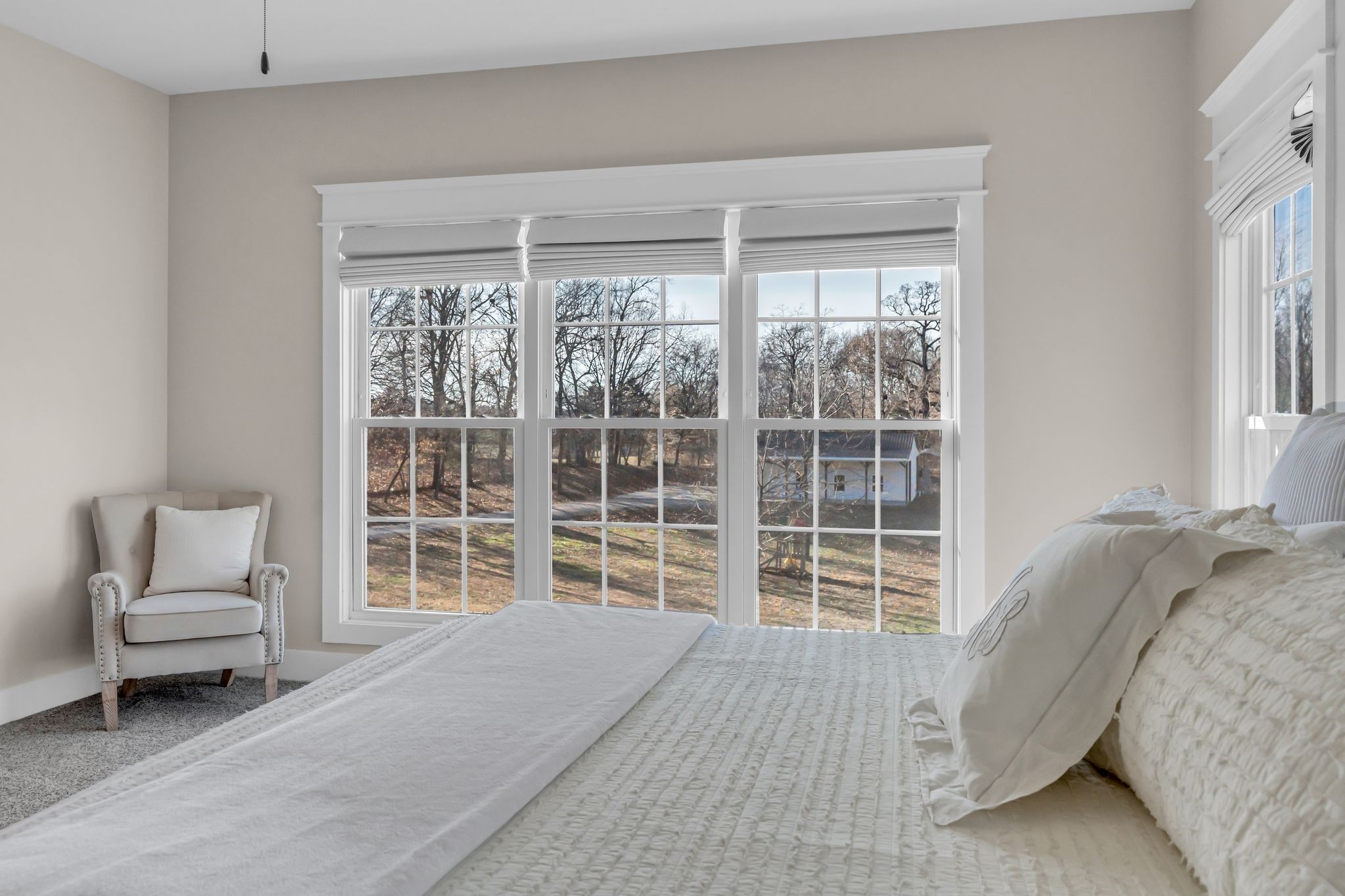 5574 Dowlen Road Cedar Hill, TN 37032 - Photo 26 of 59 a bedroom with a bed and a large window