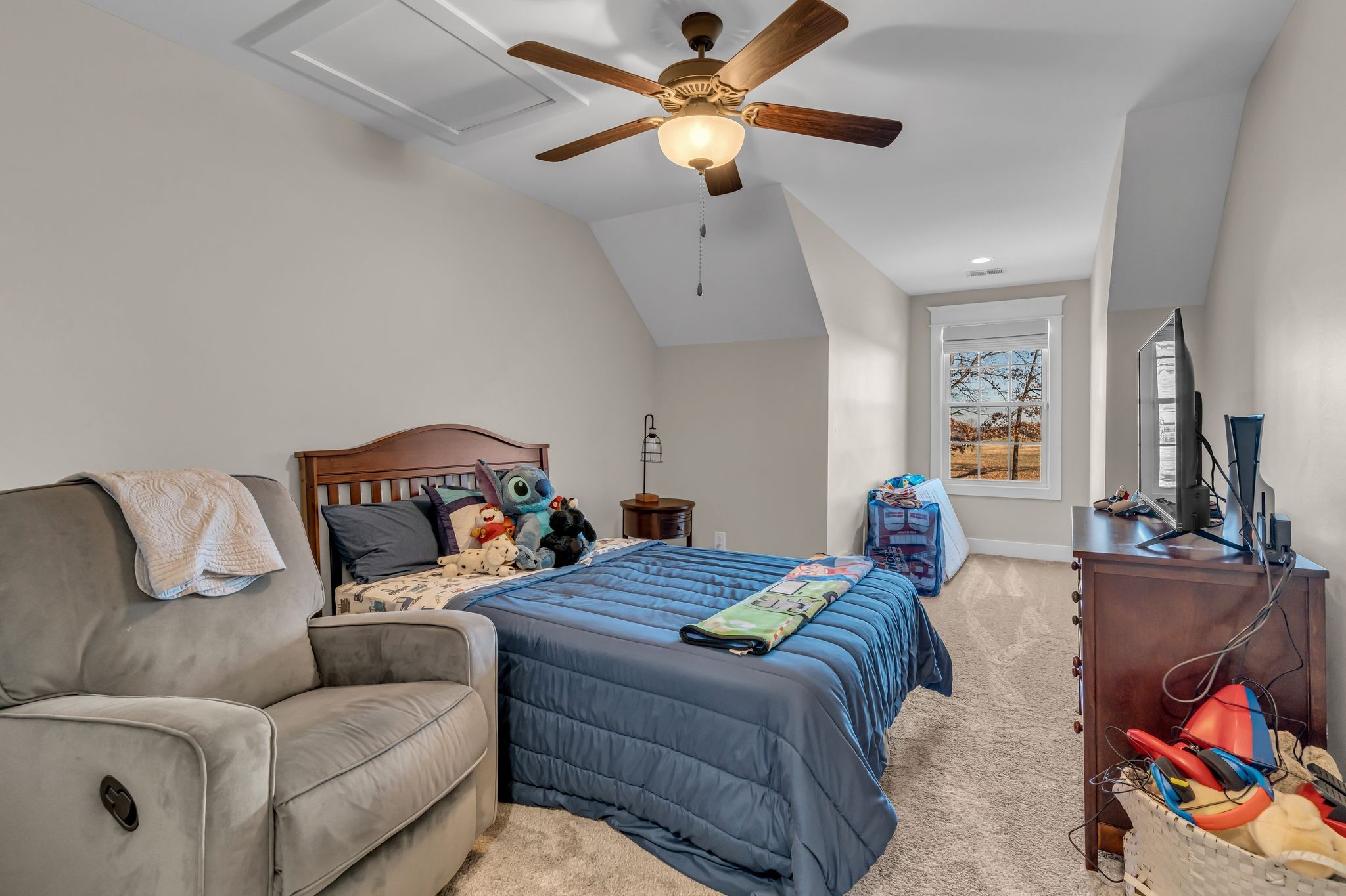 5574 Dowlen Road Cedar Hill, TN 37032 - Photo 34 of 59 a bedroom with furniture and a chandelier