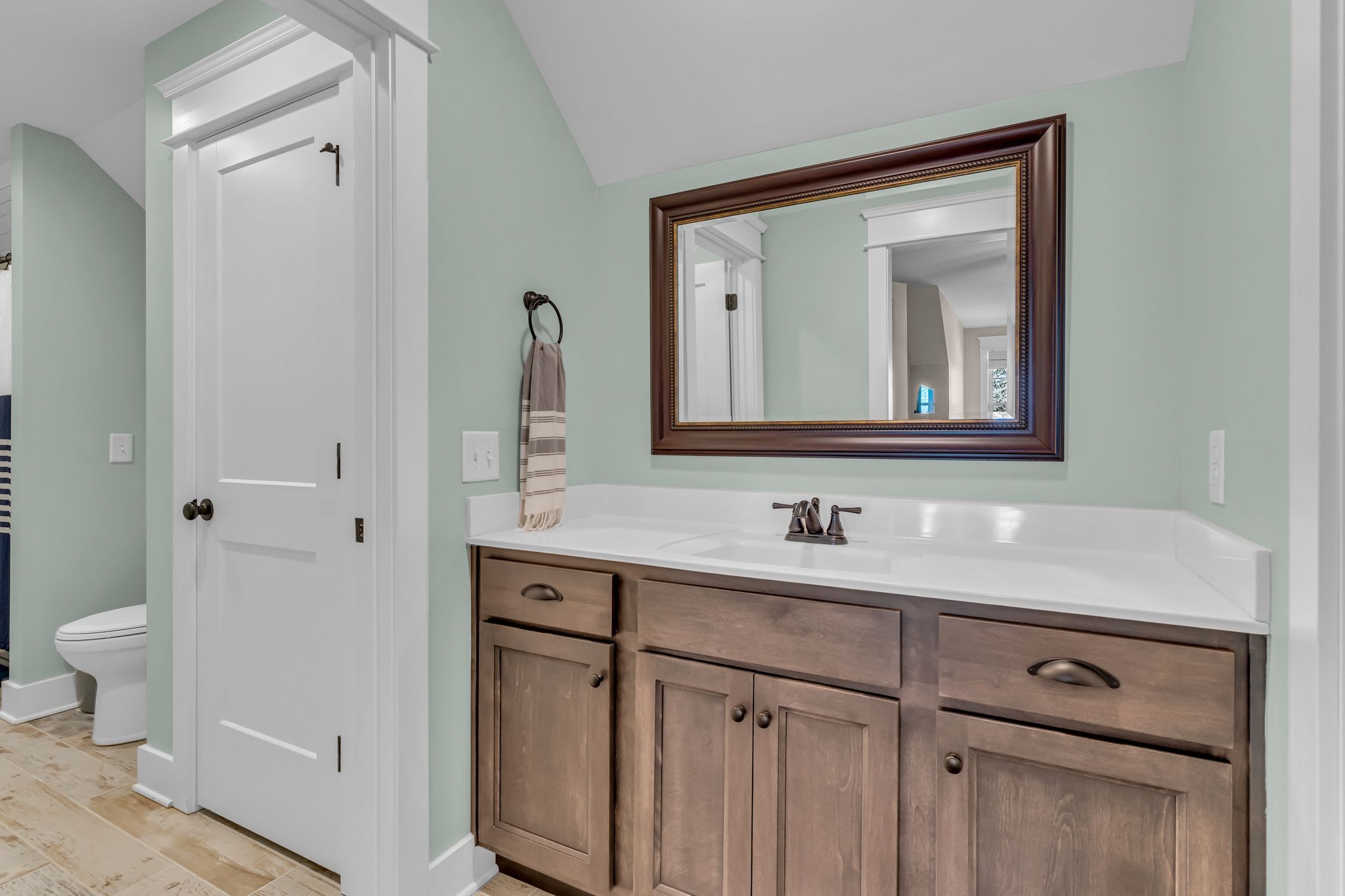 5574 Dowlen Road Cedar Hill, TN 37032 - Photo 36 of 59 a bathroom with a toilet sink and mirror
