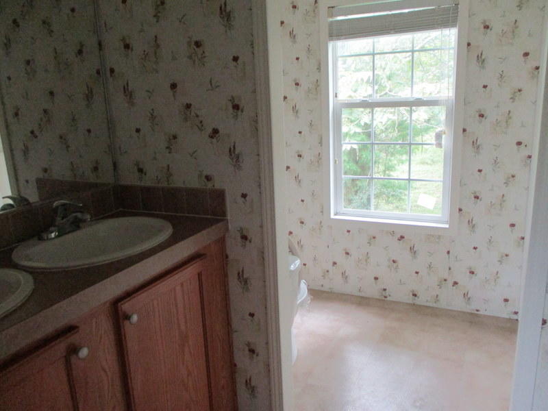 1901 Sexton Road DeFuniak Springs, FL 32433 - Photo 12 of 16 a bathroom with a sink and a vanity