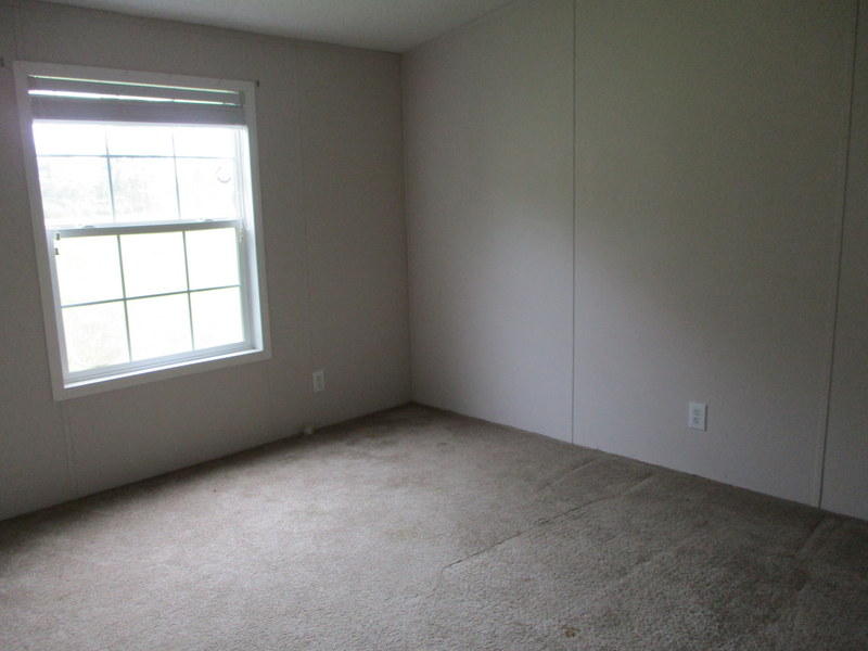 1901 Sexton Road DeFuniak Springs, FL 32433 - Photo 13 of 16 an empty room with a window
