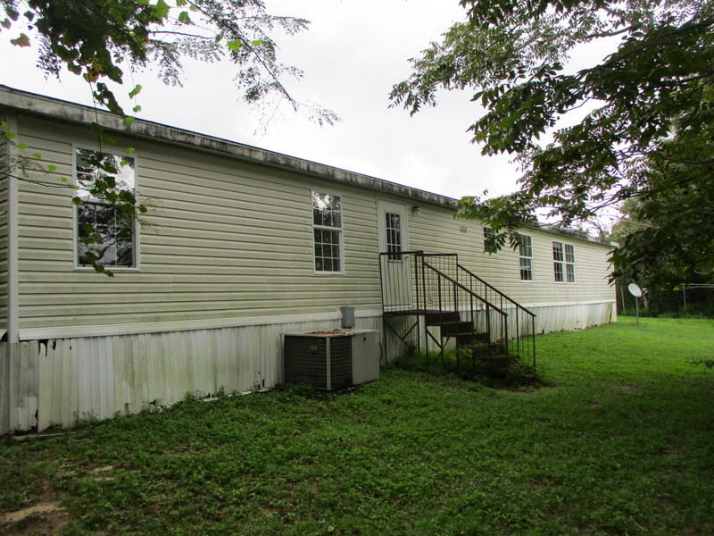 1901 Sexton Road DeFuniak Springs, FL 32433 - Photo 15 of 16 a view of backyard with barbeque grill and a large tree