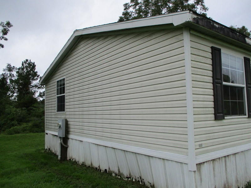 1901 Sexton Road DeFuniak Springs, FL 32433 - Photo 16 of 16 a view of a white house next to a yard