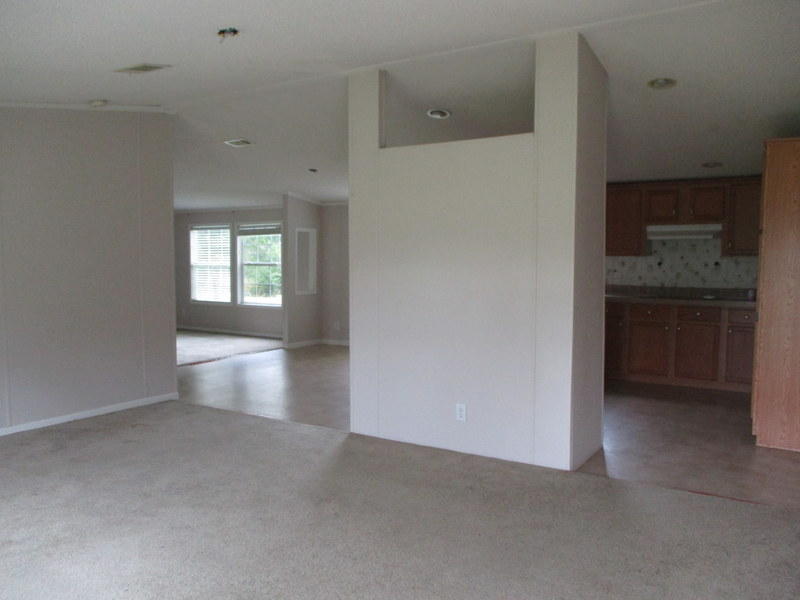 1901 Sexton Road DeFuniak Springs, FL 32433 - Photo 3 of 16 an empty room with windows and entrance