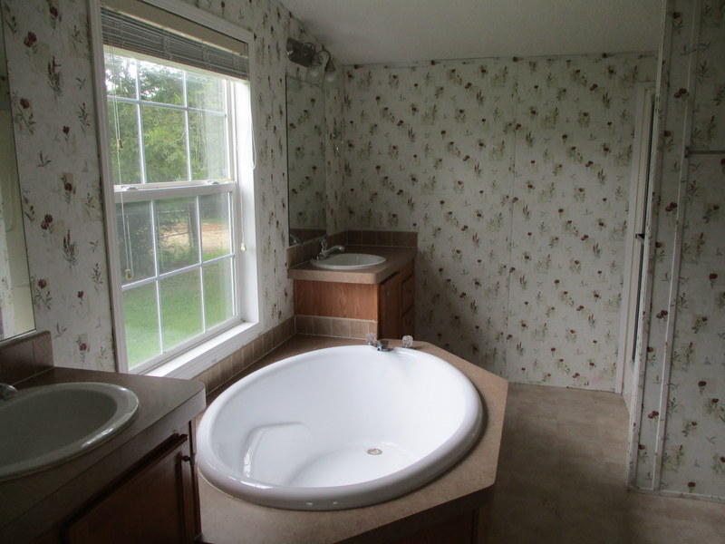 1901 Sexton Road DeFuniak Springs, FL 32433 - Photo 8 of 16 a bathroom with a toilet and a sink