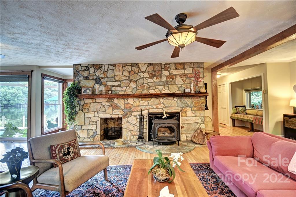 11 Echo Lake Drive Fairview, NC 28730 - Photo 18 of 48 a living room with furniture a fireplace and a large window