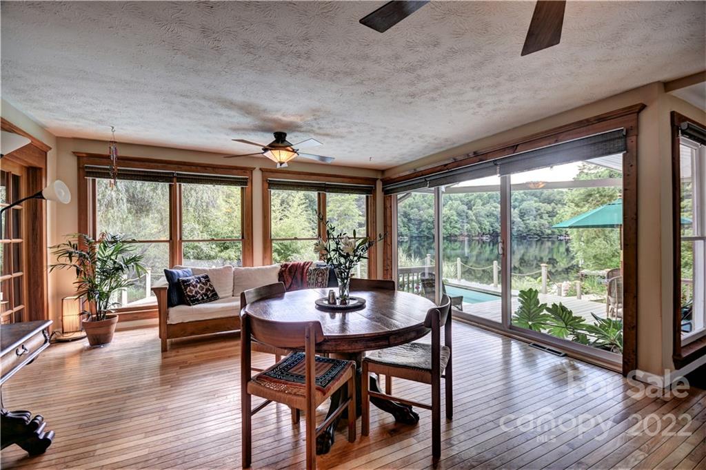 11 Echo Lake Drive Fairview, NC 28730 - Photo 19 of 48 a dining room with furniture window and wooden floor