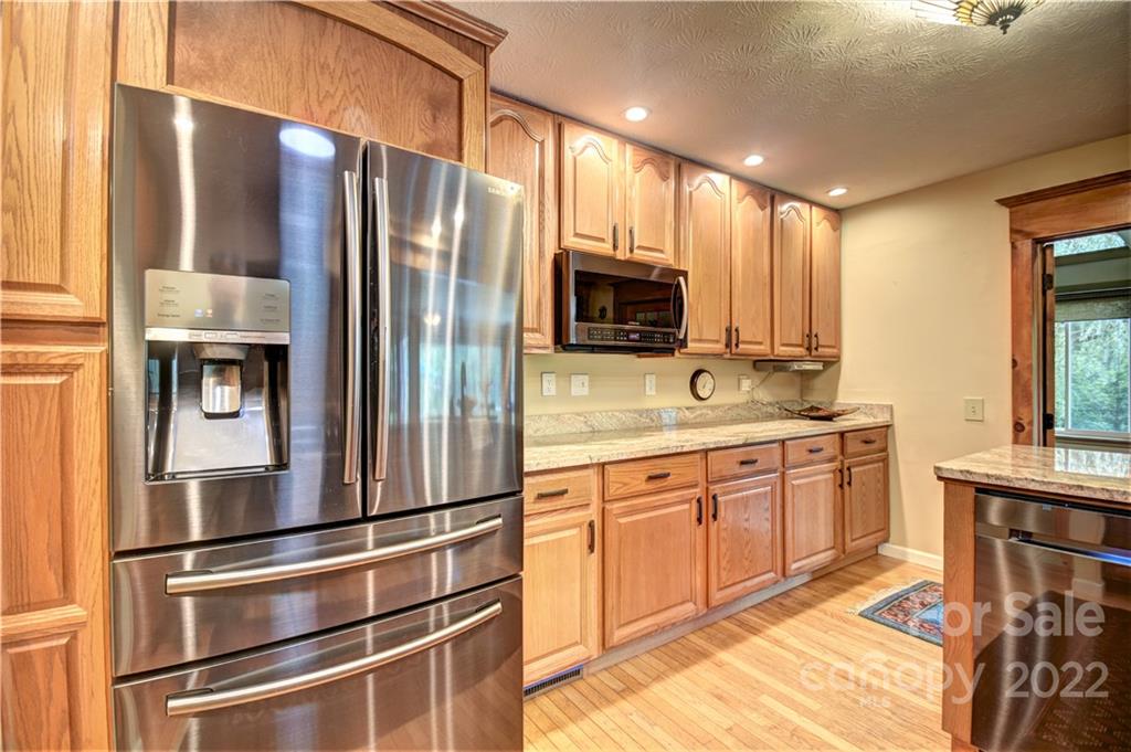 11 Echo Lake Drive Fairview, NC 28730 - Photo 24 of 48 a kitchen with stainless steel appliances a refrigerator sink and microwave