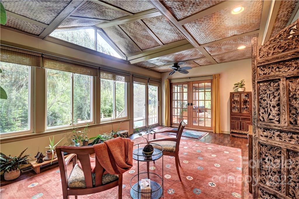 11 Echo Lake Drive Fairview, NC 28730 - Photo 25 of 48 a living room with furniture and large windows