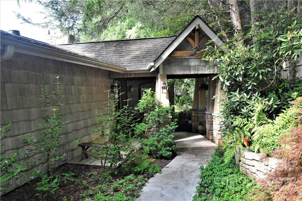11 Echo Lake Drive Fairview, NC 28730 - Photo 3 of 48 a house view with a garden space