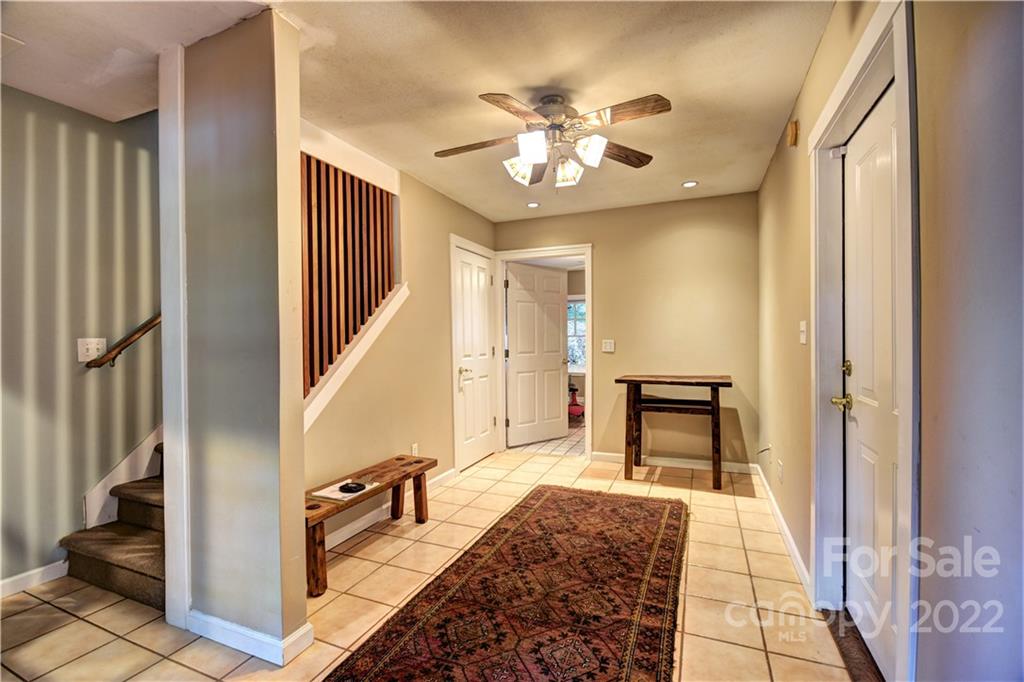 11 Echo Lake Drive Fairview, NC 28730 - Photo 44 of 48 a very nice looking room with a mirror and a rug
