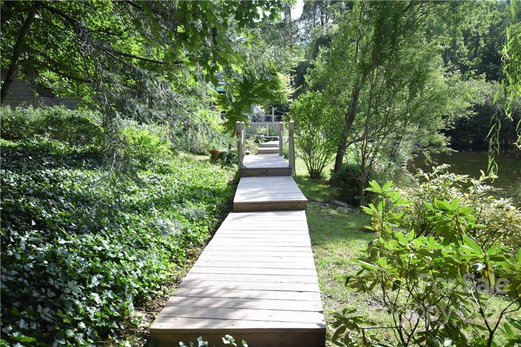 11 Echo Lake Drive Fairview, NC 28730 - Photo 5 of 48 a view of a pathway with a fountain