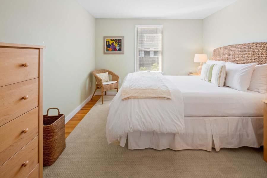 596 Shore Road, Unit 3 Truro, MA 02666 - Photo 11 of 37 a bedroom with a bed and window