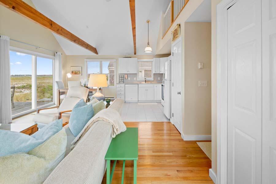 596 Shore Road, Unit 3 Truro, MA 02666 - Photo 2 of 37 a living room with furniture and a large window