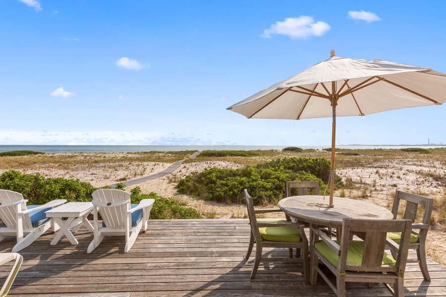 596 Shore Road, Unit 3 Truro, MA 02666 - Photo 26 of 37 an outdoor space with furniture and umbrella
