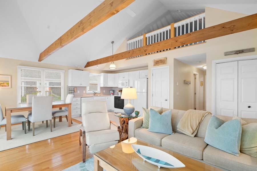 596 Shore Road, Unit 3 Truro, MA 02666 - Photo 5 of 37 a living room with furniture and a large window