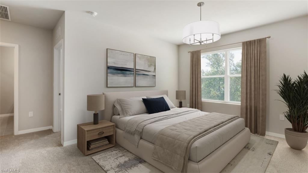17782 Shade Tree Loop Punta Gorda, FL 33982 - Photo 8 of 26 Bedroom with light colored carpet