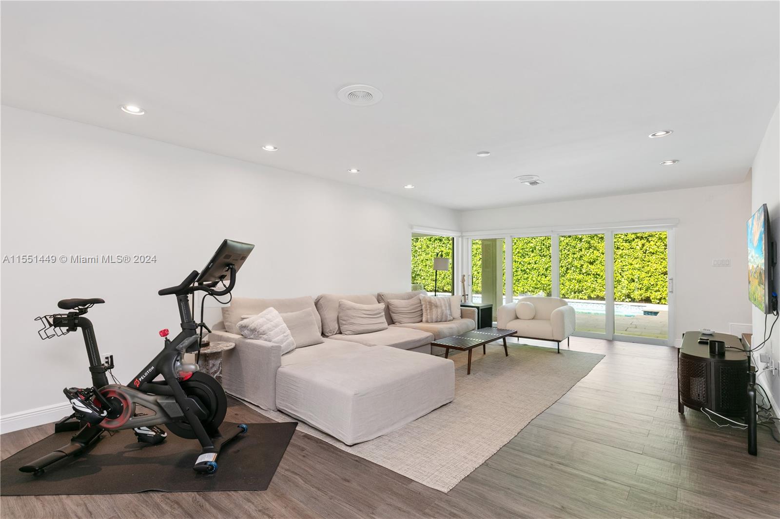 412 Ridgewood Road Key Biscayne, FL 33149 - Photo 14 of 47 a living room with furniture a window and gym