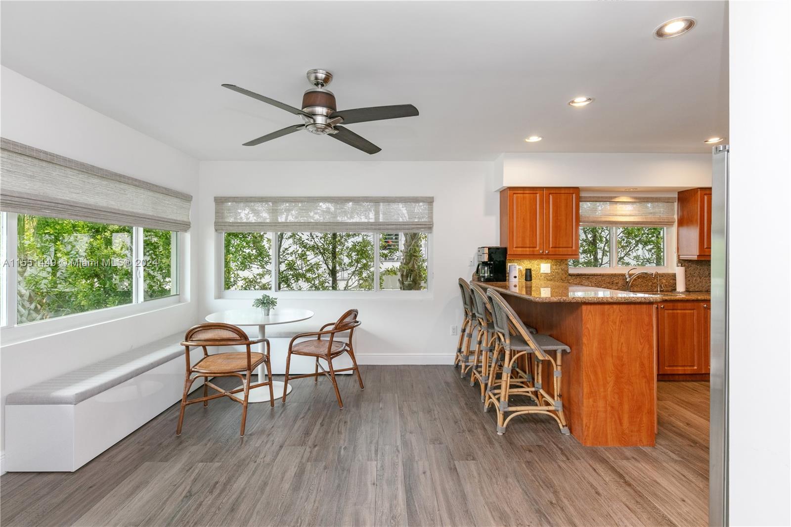 412 Ridgewood Road Key Biscayne, FL 33149 - Photo 25 of 47 a dining room with furniture window and wooden floor