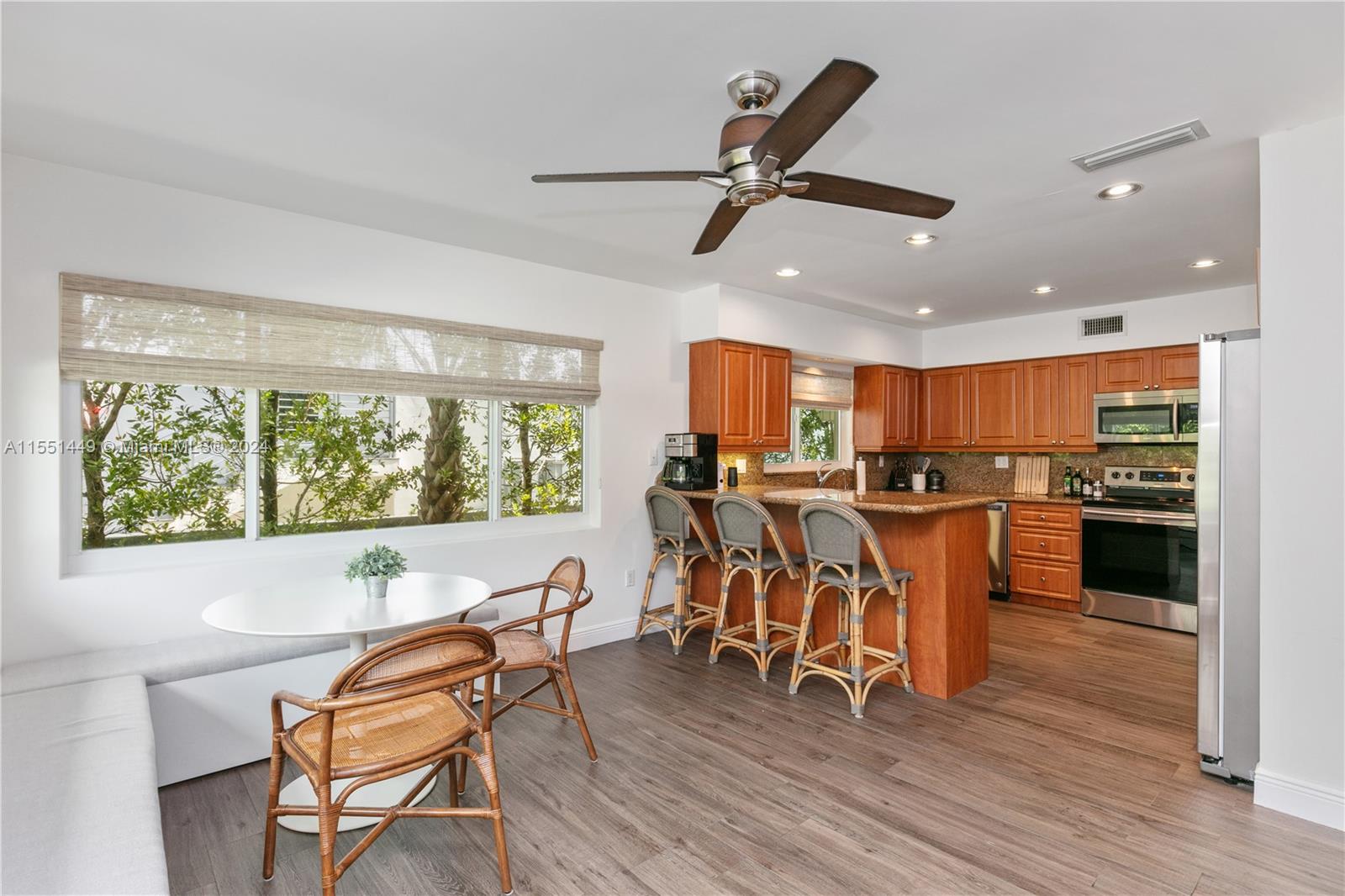 412 Ridgewood Road Key Biscayne, FL 33149 - Photo 26 of 47 a view of a dining room with furniture window and wooden floor