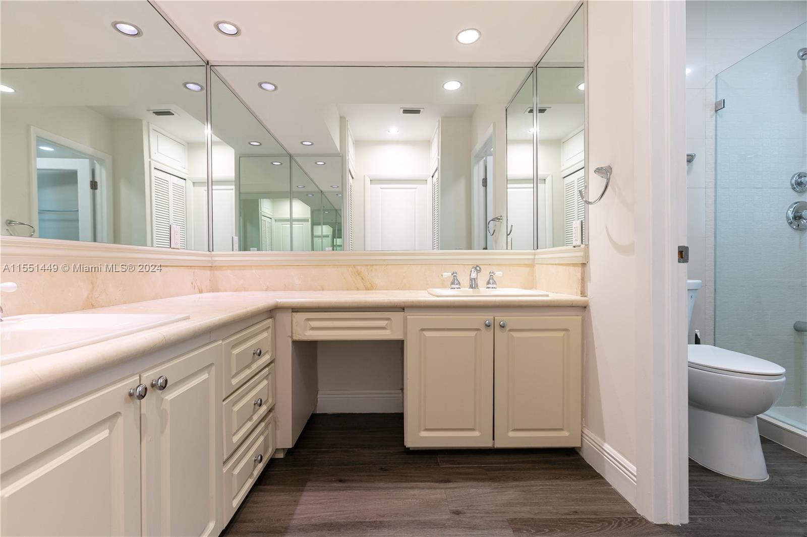 412 Ridgewood Road Key Biscayne, FL 33149 - Photo 35 of 47 a bathroom with a double vanity sink mirror and toilet