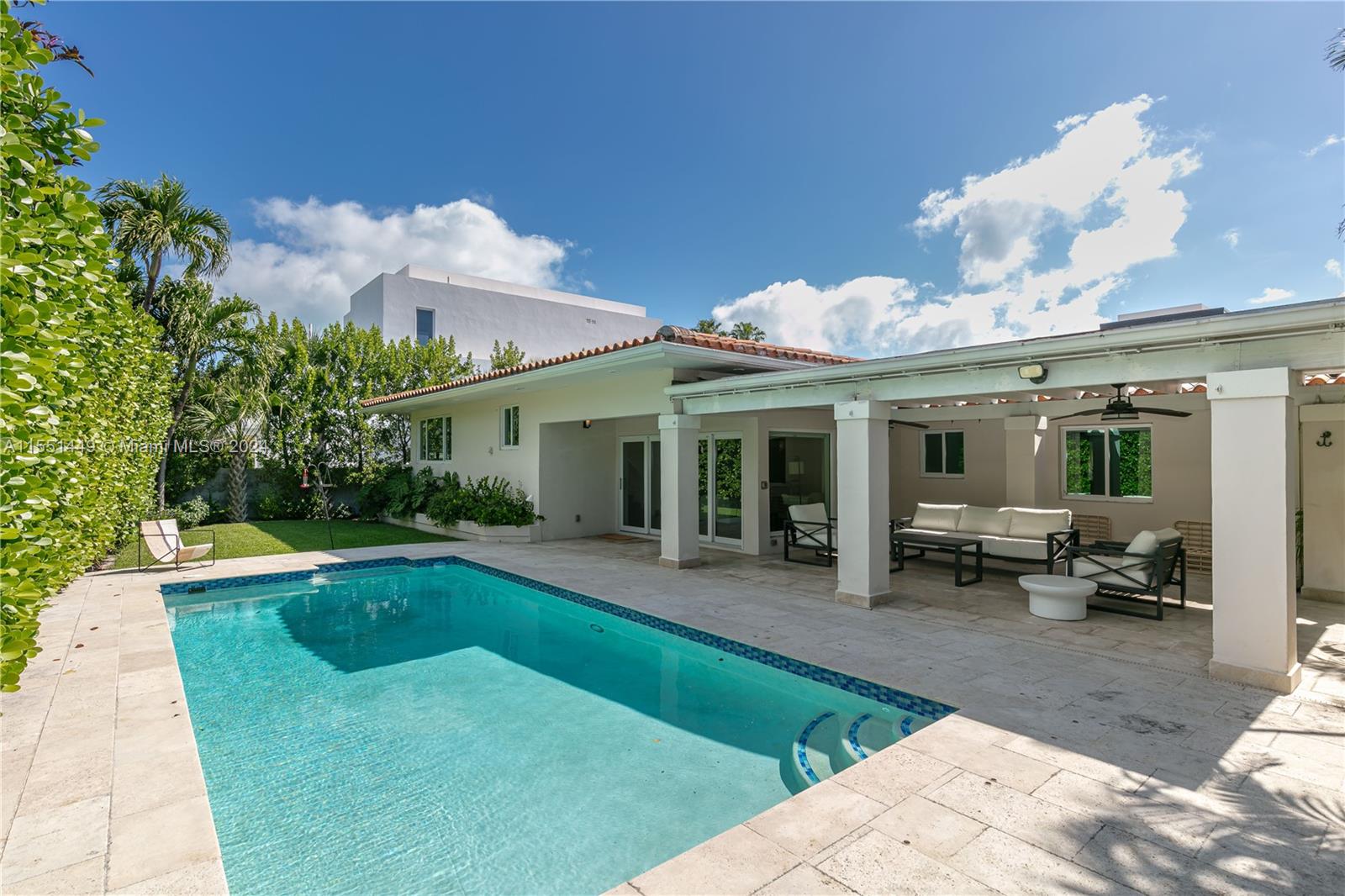412 Ridgewood Road Key Biscayne, FL 33149 - Photo 43 of 47 a view of a house with swimming pool and sitting area