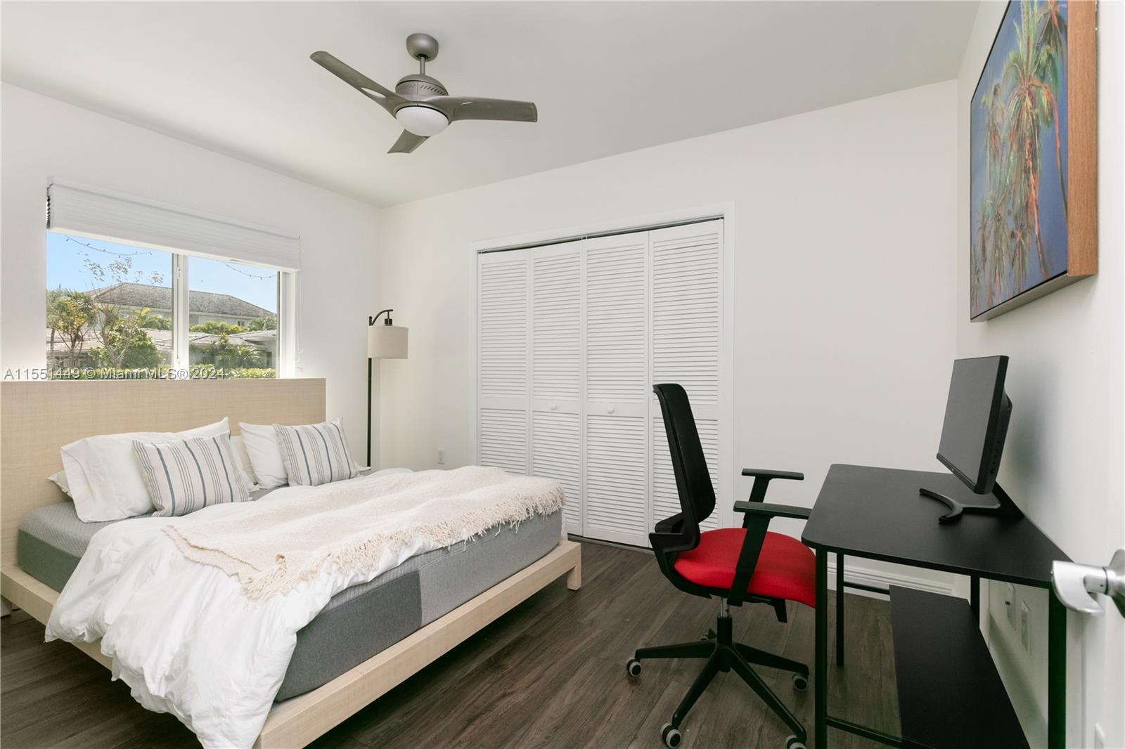 412 Ridgewood Road Key Biscayne, FL 33149 - Photo 8 of 47 a bedroom with a bed a chair and a window