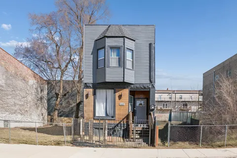 a front view of a house with glass windows