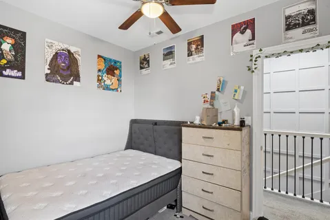 a bedroom with a bed and cabinets