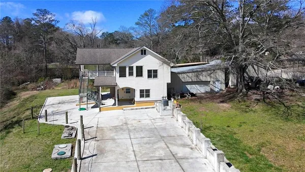 a view of a house with a yard porch and sitting area