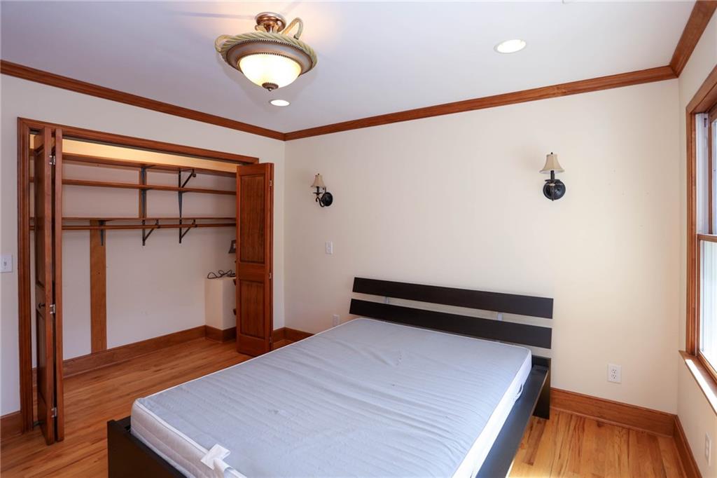 3602 Jones Mill Road Peachtree Corners, GA 30360 - Photo 12 of 35 a bedroom with a bed and a ceiling fan