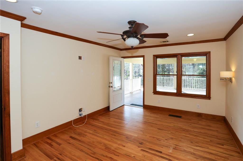 3602 Jones Mill Road Peachtree Corners, GA 30360 - Photo 15 of 35 a view of an empty room with wooden floor and a window