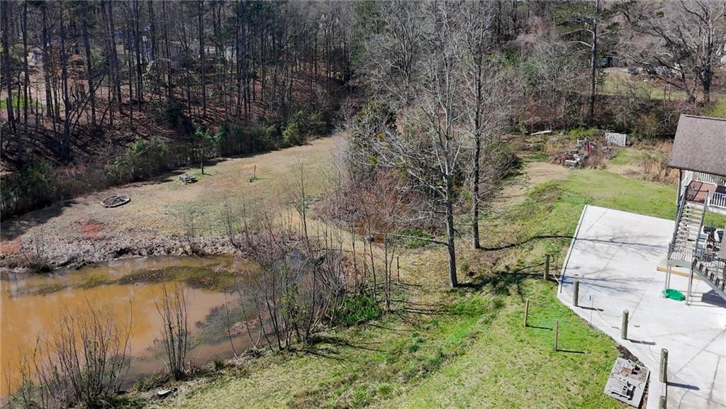 3602 Jones Mill Road Peachtree Corners, GA 30360 - Photo 34 of 35 a view of a lake with a yard