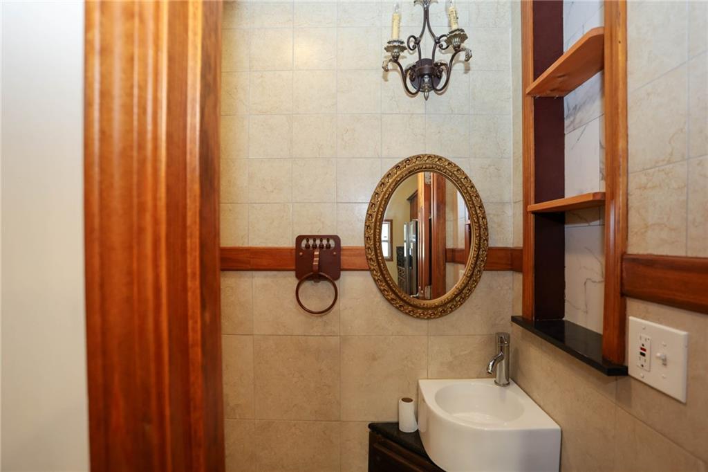 3602 Jones Mill Road Peachtree Corners, GA 30360 - Photo 8 of 35 a bathroom with a sink a mirror and a toilet