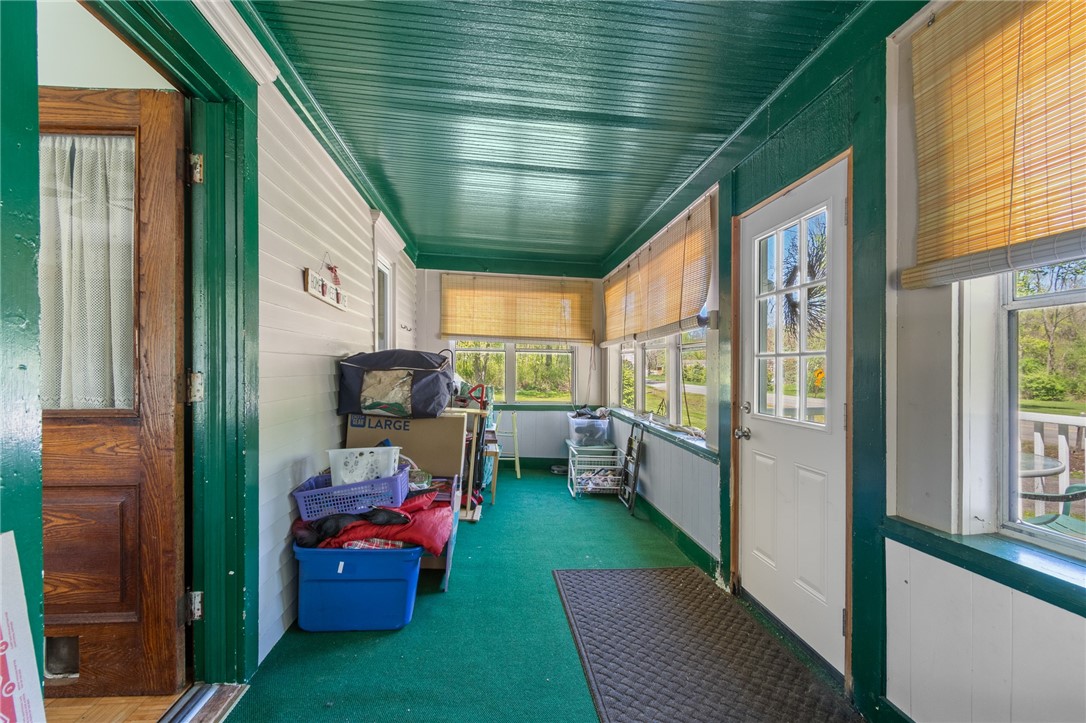 5443 Russell Road Marion, NY 14505 - Photo 45 of 48 The front ENCLOSED PORCH - a great area for play!