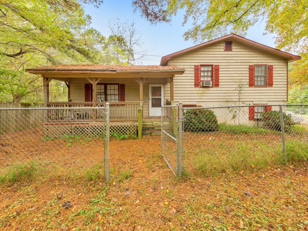 1206 Cotton Road Canton, GA 30115 - Photo 1 of 1 a front view of a house with a yard