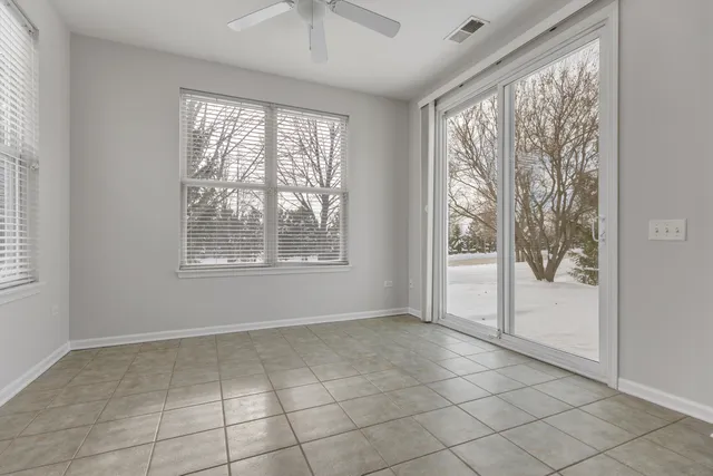 a view of an empty room and a window