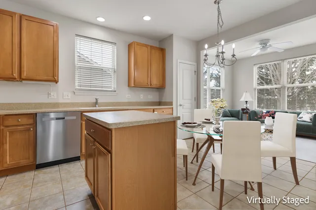 a kitchen that has a lot of cabinets in it and a sink