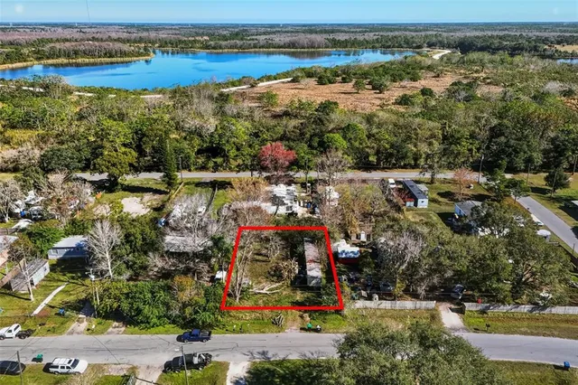 an aerial view of ocean and residential houses