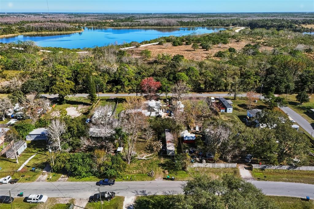 351 Exeter Street Orlando, FL 32820 - Photo 2 of 20 an aerial view of lake and residential houses with outdoor space